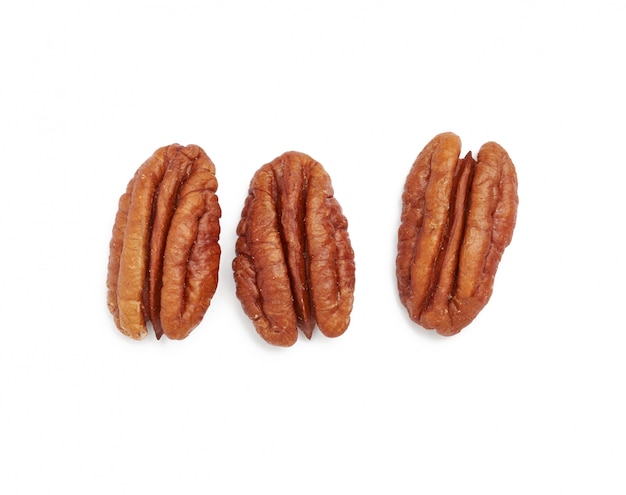 Heap of peeled pecans isolated on a white space