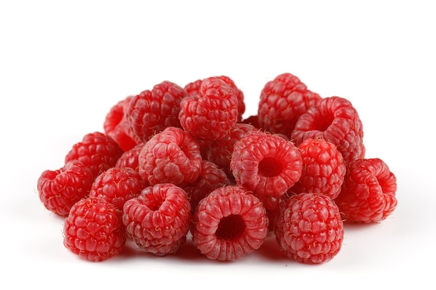 Heap of raspberries on white isolate