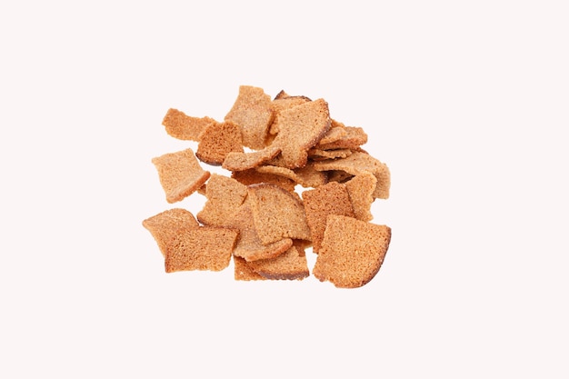 Heap of rye crackers isolated on white background High quality photo