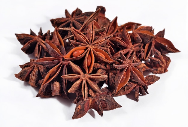 Heap of star anise on a white background