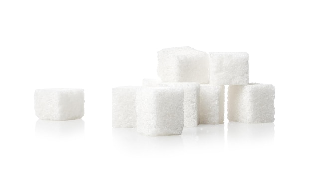 Heap of sugar cubes isolated on white background