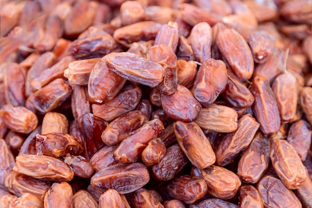 Heap of sun dried dates on the market