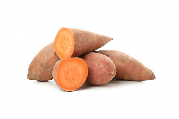 Heap of Sweet potatoes isolated on white surface