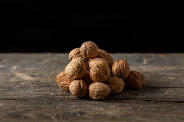 Heap of walnuts on wooden boards