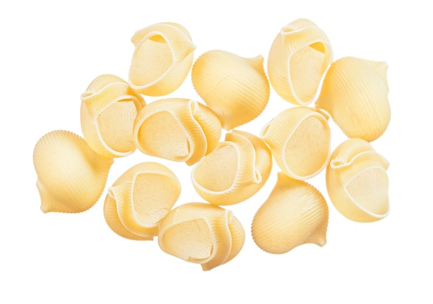 Heap of wholegrain pasta shells isolated on white