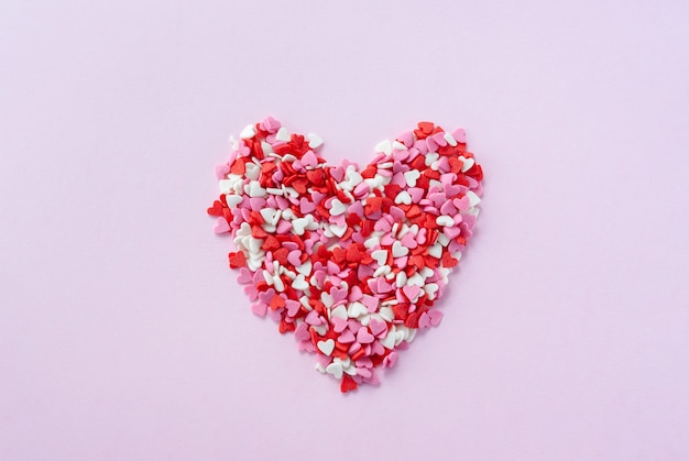 Heart made from little red, white and pink sugar hearts