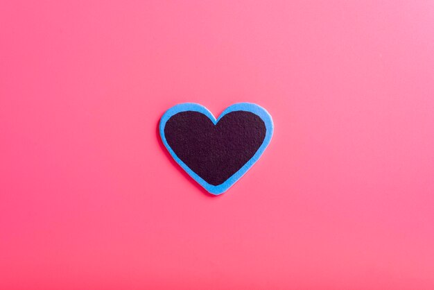 Heart on a pink background in the middle The concept of Valentine's day