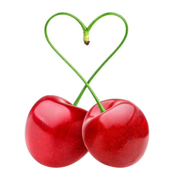 Heart shape from two cherries over white