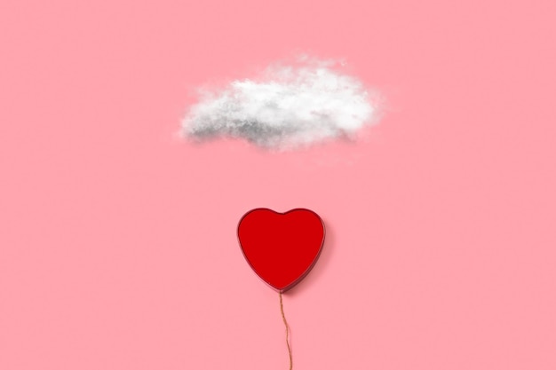 A heart shape open box and in the shape of a balloon with a white cloud on a pink background