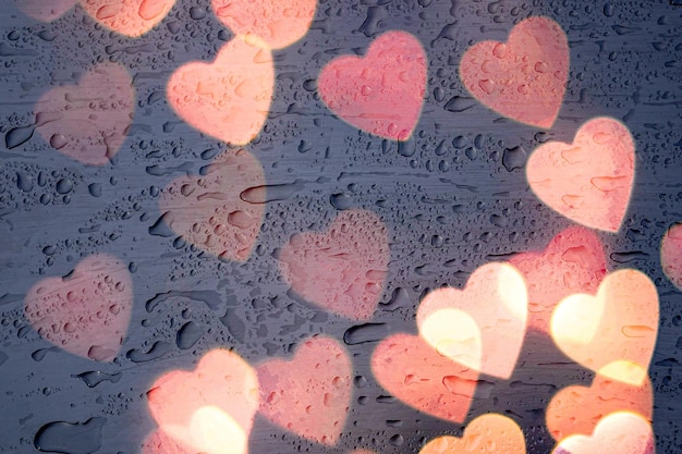 heart shape and raindrops on the window