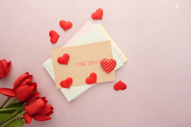 Heart shape symbol and envelope on color d background