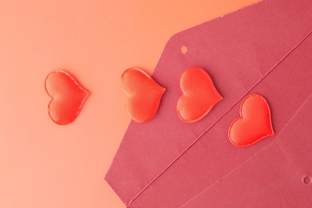 Heart shape symbol and envelope on red background