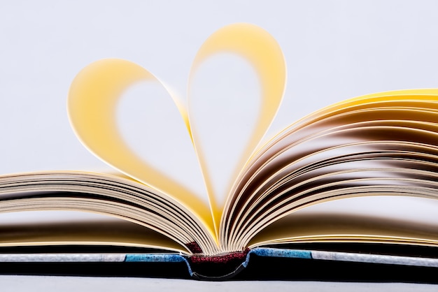 Heart Shaped Book. Book page in heart shape, focus on foreground.