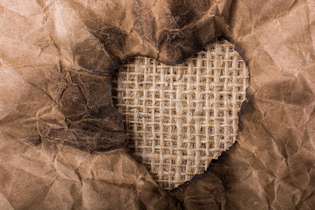 Heart shaped burnt out of a paper