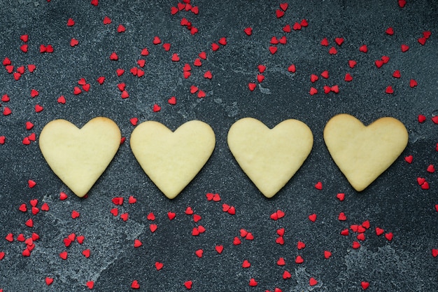 Heart shaped cookies for valentine's day on dark background.