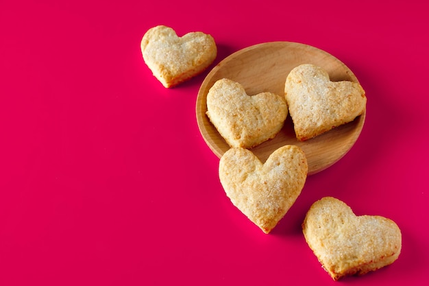 Heart shaped cookies for valentines day on pink background