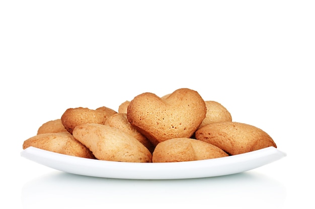 Heart-shaped cookies on white plate isolated on white