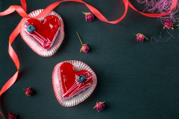 Heart shaped dessert on a slate board, romantic evening, overhead flat lay