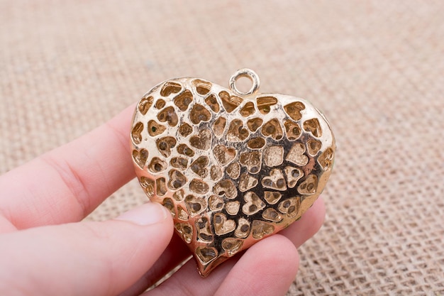 Heart shaped gold color metal object