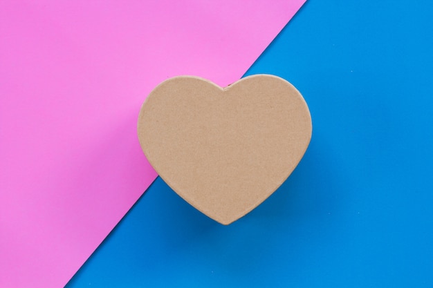 Heart-shaped paper box with a color background.