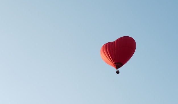 Heart shaped red balloon. Air entertainment. Hot air balloon flights.