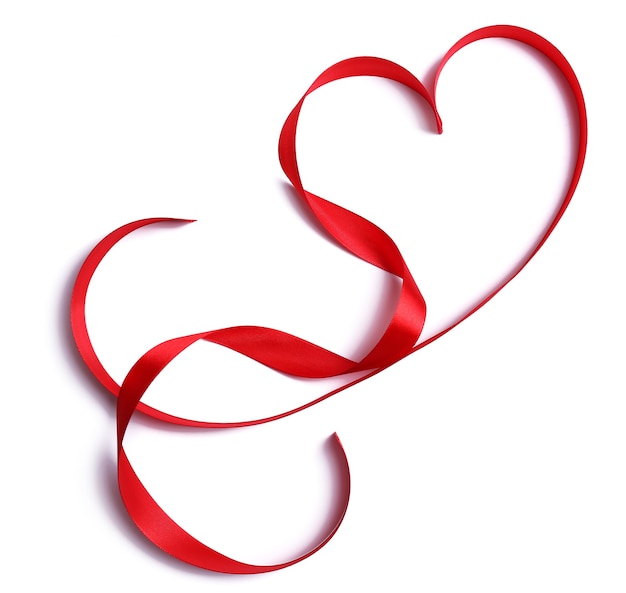 Heart shaped shiny red satin ribbon isolated on white