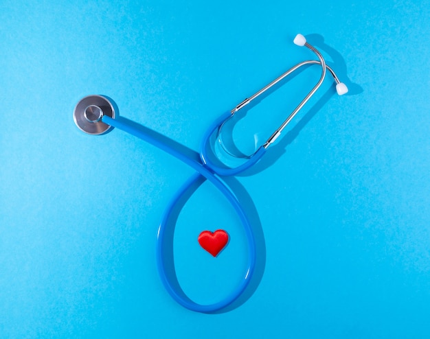 heart and stethoscope on blue background