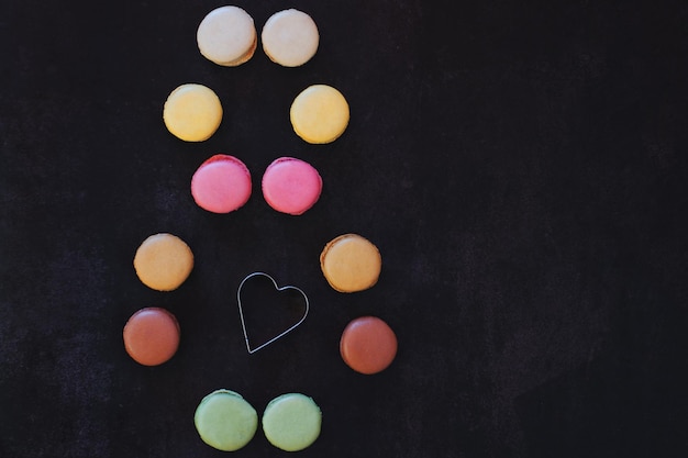 Heart of sweet candies. Colorful macaroons. Valentine's Day. 14 of February. Flat lay, top view. Gif