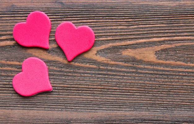 Hearts on a wooden background