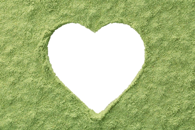 Heartshaped frame made from wheat grass powder on white background