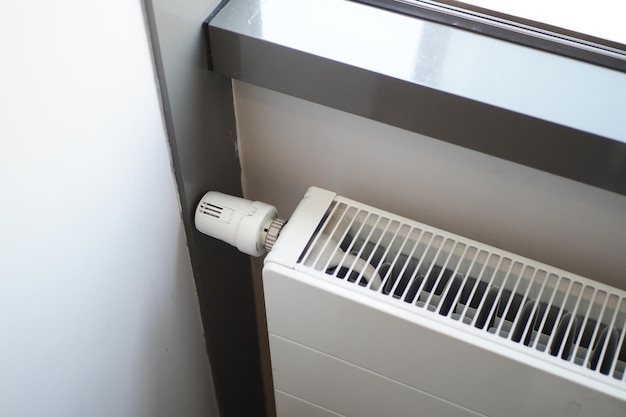 Heating radiator under window in the room