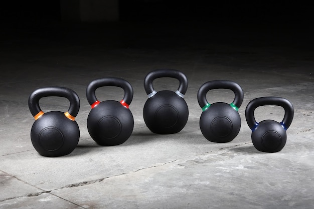 Heavy black kettlebells are ready to exercise