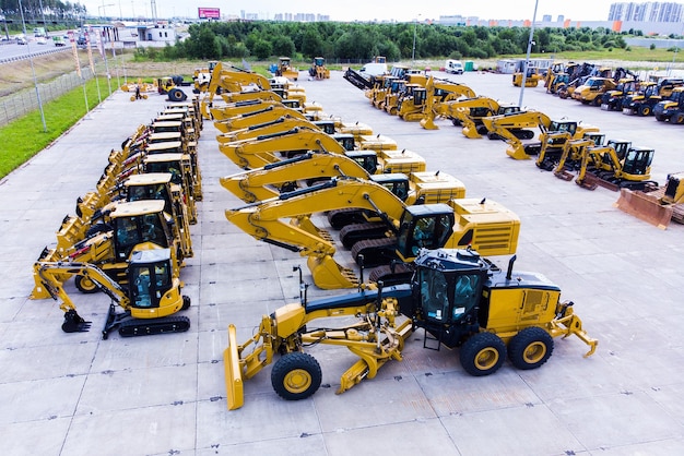 Heavy construction equipment store excavator bulldozer grader front loader Aerial view