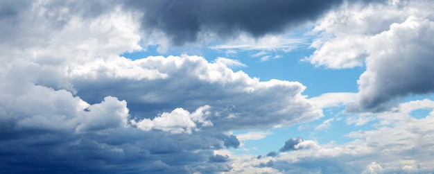 Heavy dark big clouds in the blue sky Dramatic sky with blue and gray clouds