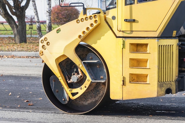 Heavy duty vibratory road roller for asphalt concrete works and road repairs. close-up. Heavy machinery when repairing asphalt pavement.