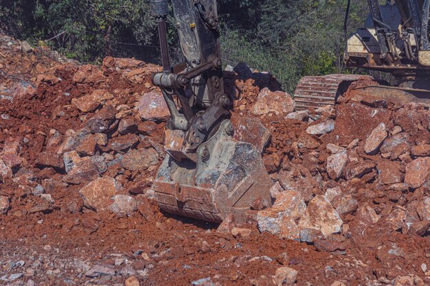 Heavy machinery works at the construction site Clearing rocky soil for construction in Turkey