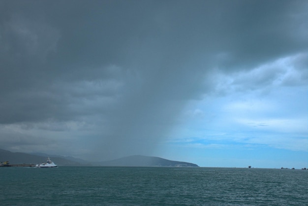 Heavy rain over the Black Sea Dark clouds with a band of rain in the blue sky