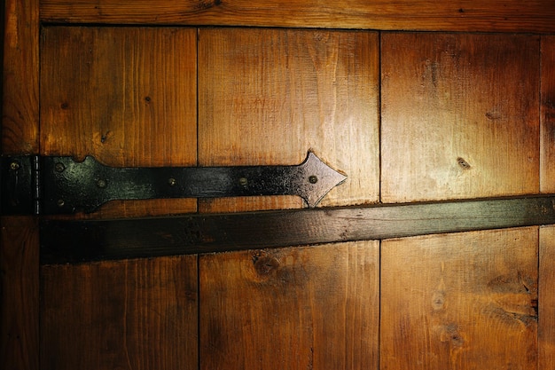 Heavy wooden door texture Varnished with heavy bar hinges