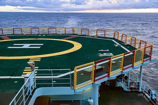 The helipad of the ship. Helipad on the ship at sunset.