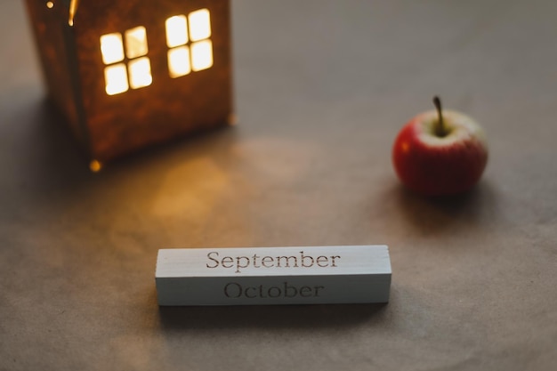 Hello september autumn card with fresh red apples on white background top view