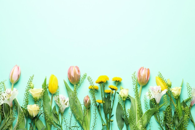 Hello spring concept with flowers on mint background