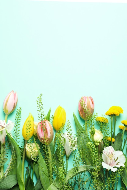 Hello spring concept with flowers on mint background