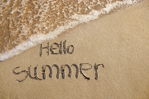 Hello summer written on beach. 