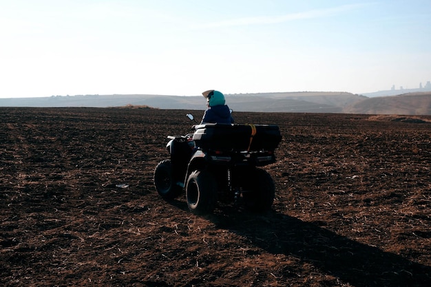 helmet sitting on atv quad bike in mountains