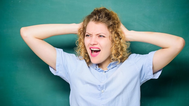 Help me homework education September 1 girl teacher at school lesson knowledge day empty blackboard information back to school Girl likes studying screaming student at blackboard