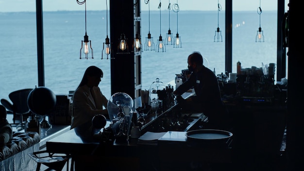 Helpless businesswoman silhouette drinking cocktail ocean view Personal crisis