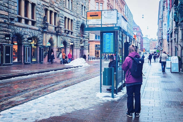 Helsinki, Finland - March 8, 2017: Passenger bus stop Street in Helsinki, Finland in winter.