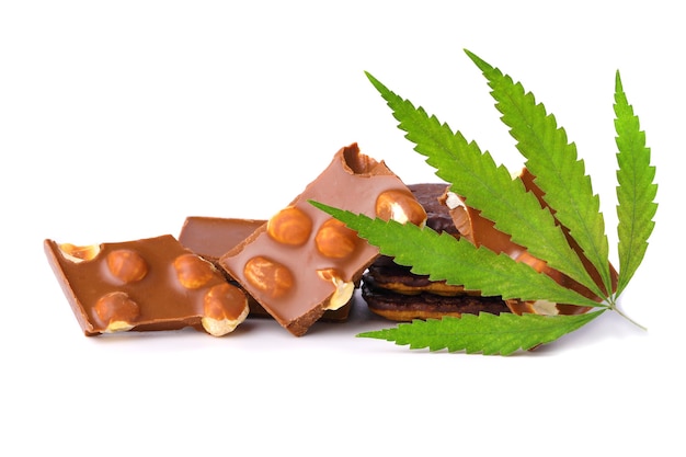 Hemp leaf with chocolate pieces with nuts containing CBD cannabis