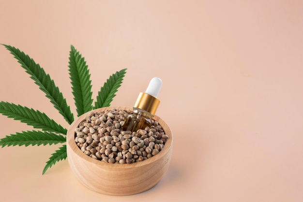 Hemp seeds with green sativa hemp leaf on top Legalized marijuana concept