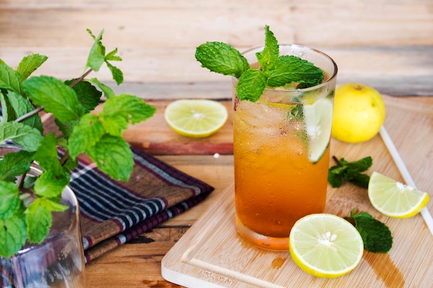 herbal drinks iced lemon tea for health care arrangement on wooden